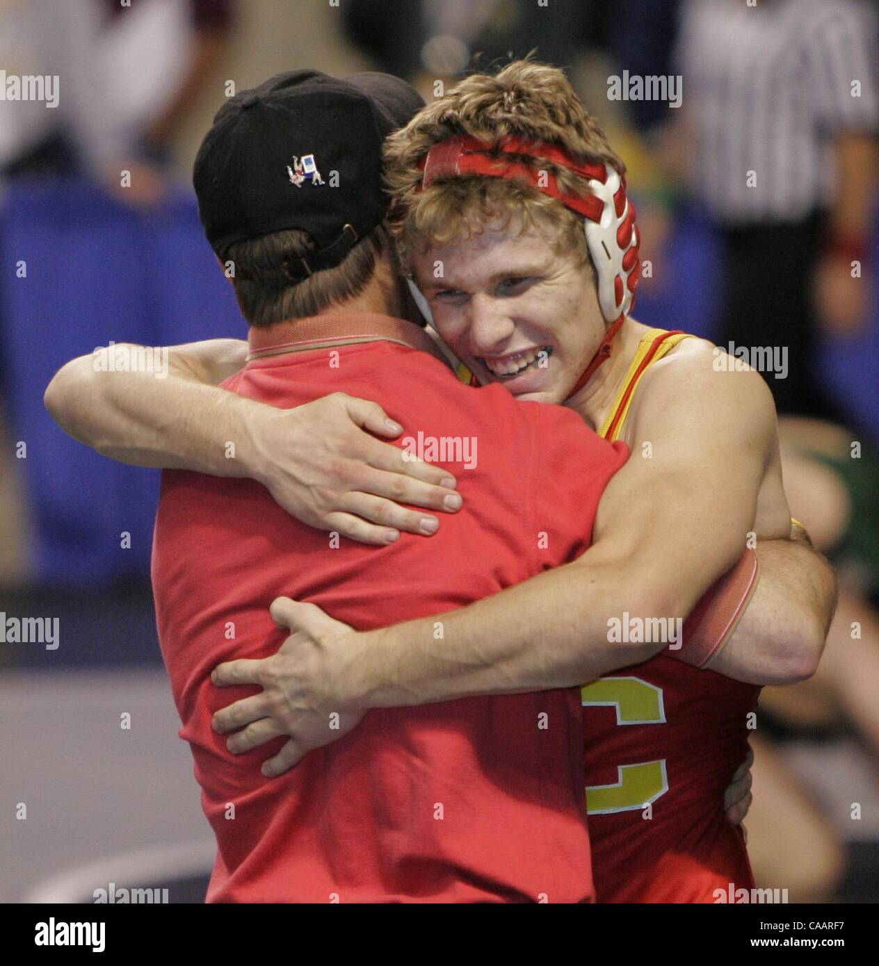 (Published 3/10/2005, NC-7, NI-7) Mt. Carmel's 145 lb. TODD McKAY hugs JOSE CAMPO, one of his coaches, after his consolation match victory over Anthony Box, of Bakersfield High School, 7 to 4.  U/T photo CHARLIE NEUMAN Stock Photo