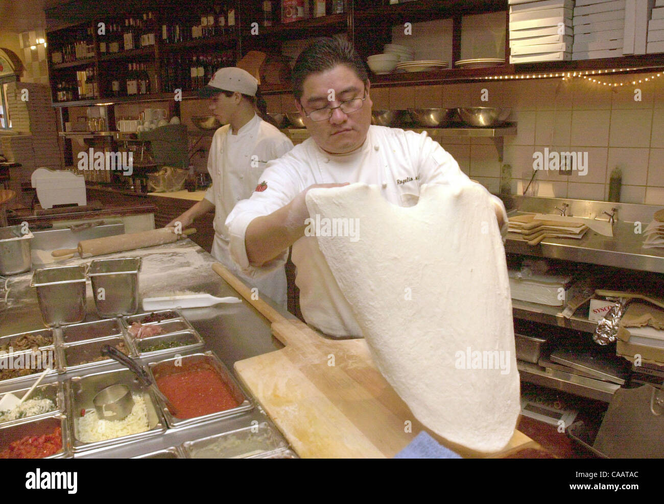 Regional chef Rogelio Jacinto prepares the dough to make a pizza at Tomatina's in Walnut Creek Sunday February 22,2004. (Contra Costa Times/Bob Larson)2004 Stock Photo