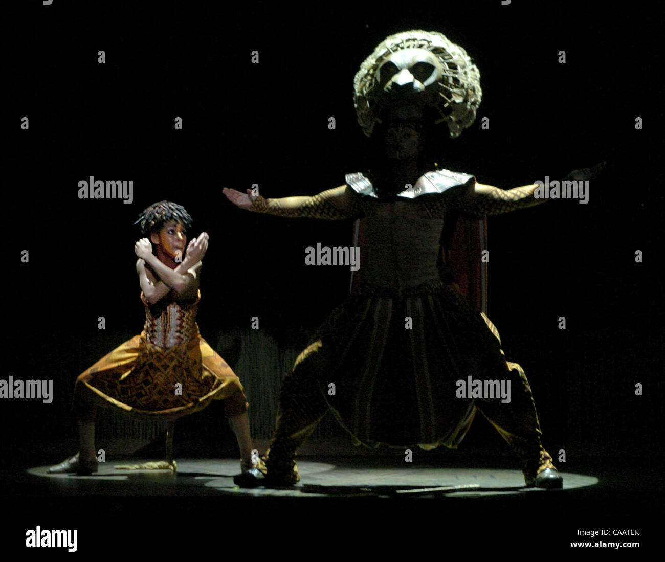 Young Simba, played by Alexander V. Bass, imitates his father Mufasa, played by Rufus Bonds Jr., during opening night of the Best of Broadway production of Disneys The Lion King Feb. 2, 2004 at the Orpheum Theatre in San Francisco, Calif.      (Bob Pepping/Contra Costa Times) Stock Photo