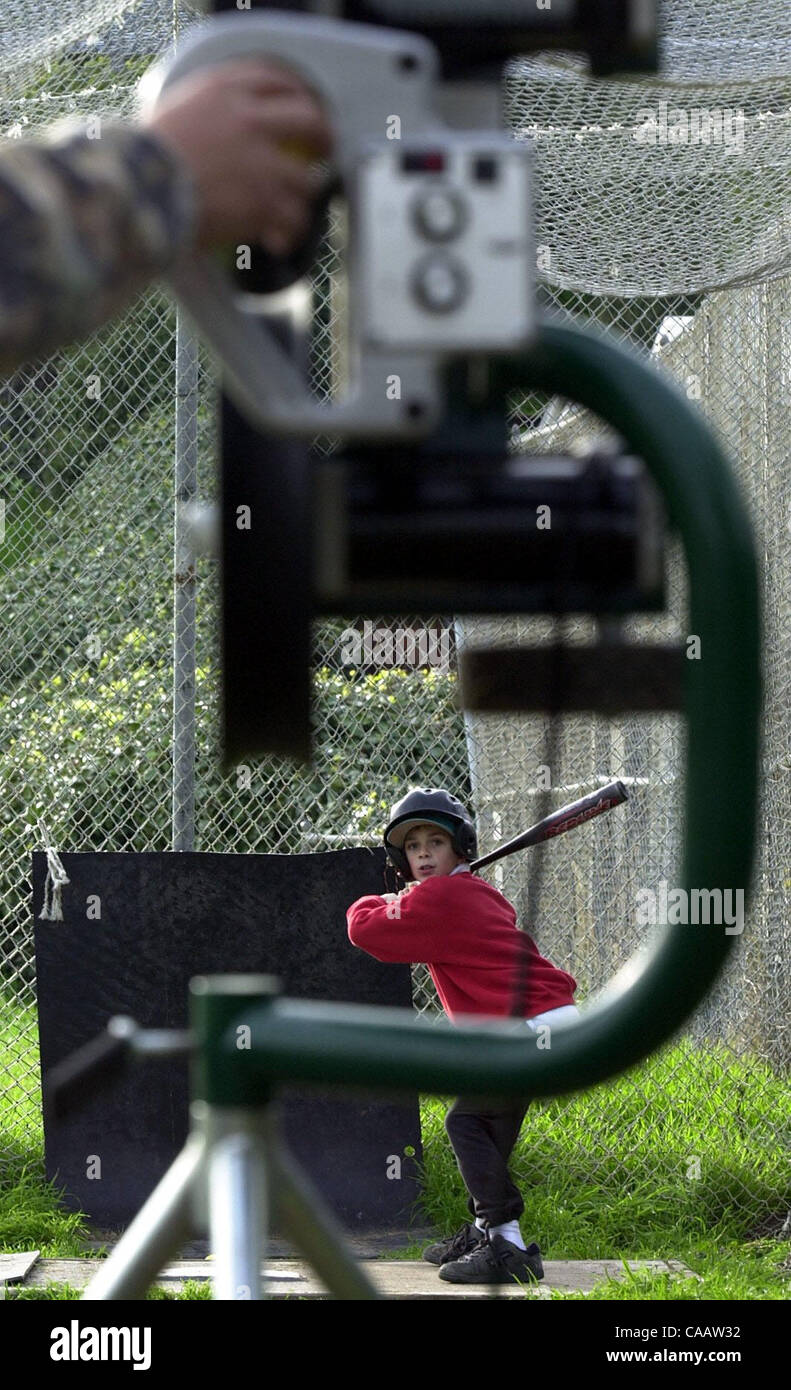 Damon Palacio, 10, of the Blue Bombers waits for his dad Chris to launched out a ball from the pitching machine as his practices his swing at Left Gomez Field on Thursday February 5, 2004 in Rodeo, Calif.  The season starts on March 13.  (Contra Costa Times/ Gregory Urquiaga) Stock Photo