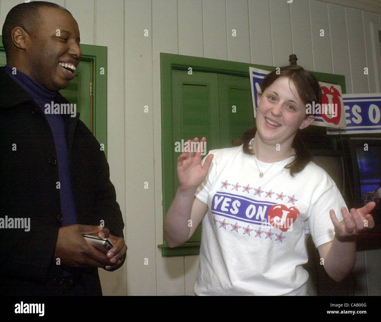George Harris III introduces Vanessa Pratt, 17, of Kensington, an El Cerrito High School student who dedicated her Saturday mornings to help organize the Measure J campaign at election night party at Chevy's restaurant in Richmond, Calif., on Tuesday March 02, 2004. Pratt was involved with student o Stock Photo
