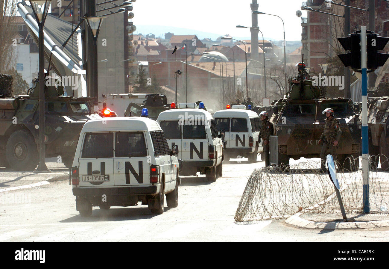 Mar 22, 2004; Kosovo, SERBIA; UN and NATO peacekeepers barricade the bridge which divides the troubled city of Kosovska Mitrovica into North (controlled by Serbs) and South (controlled by Albanians). The bridge is blocked with KFOR troops and armoured vehicles to prevent both sides from crossing the Stock Photo