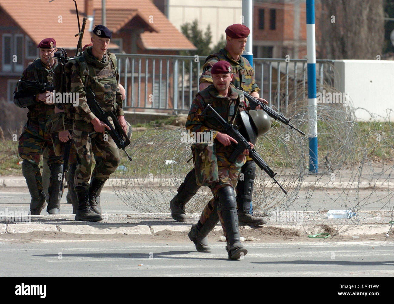 Mar 22, 2004; Kosovo, SERBIA; Belgium soldiers, part of NATO-led peacekeepers in Kosovo (KFOR), during patrol in the North part of Kosovska Mitrovica, near the bridge that divides this troubled city into North (controlled by Serbs) and South (controlled by Albanians). Riots broke out in at least six Stock Photo