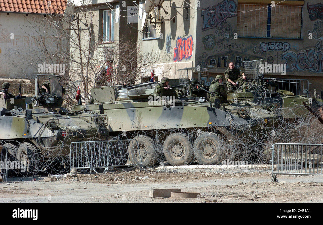 Mar 22, 2004; Kosovo, SERBIA; Armoured vehicles, part of NATO-led peacekeepers (KFOR) in Kosovo, providing security in the North part of Kosovska Mitrovica, near the bridge that divides this troubled city into North (controlled by Serbs) and South (controlled by Albanians). Riots broke out in at lea Stock Photo