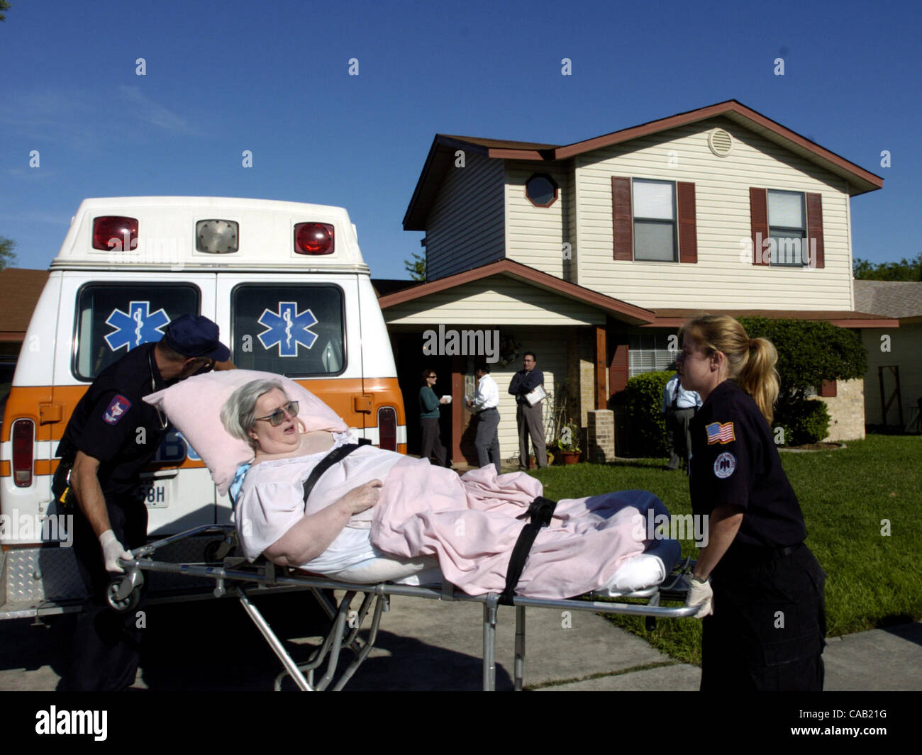METRO - A resident is removed by private ambulance from an unliscensed elderly care center in the 2100 block of James Bonham Tuesday, March 30, 2004. The residents were moved to a licensed facility. BAHRAM MARK SOBHANI/STAFF Stock Photo