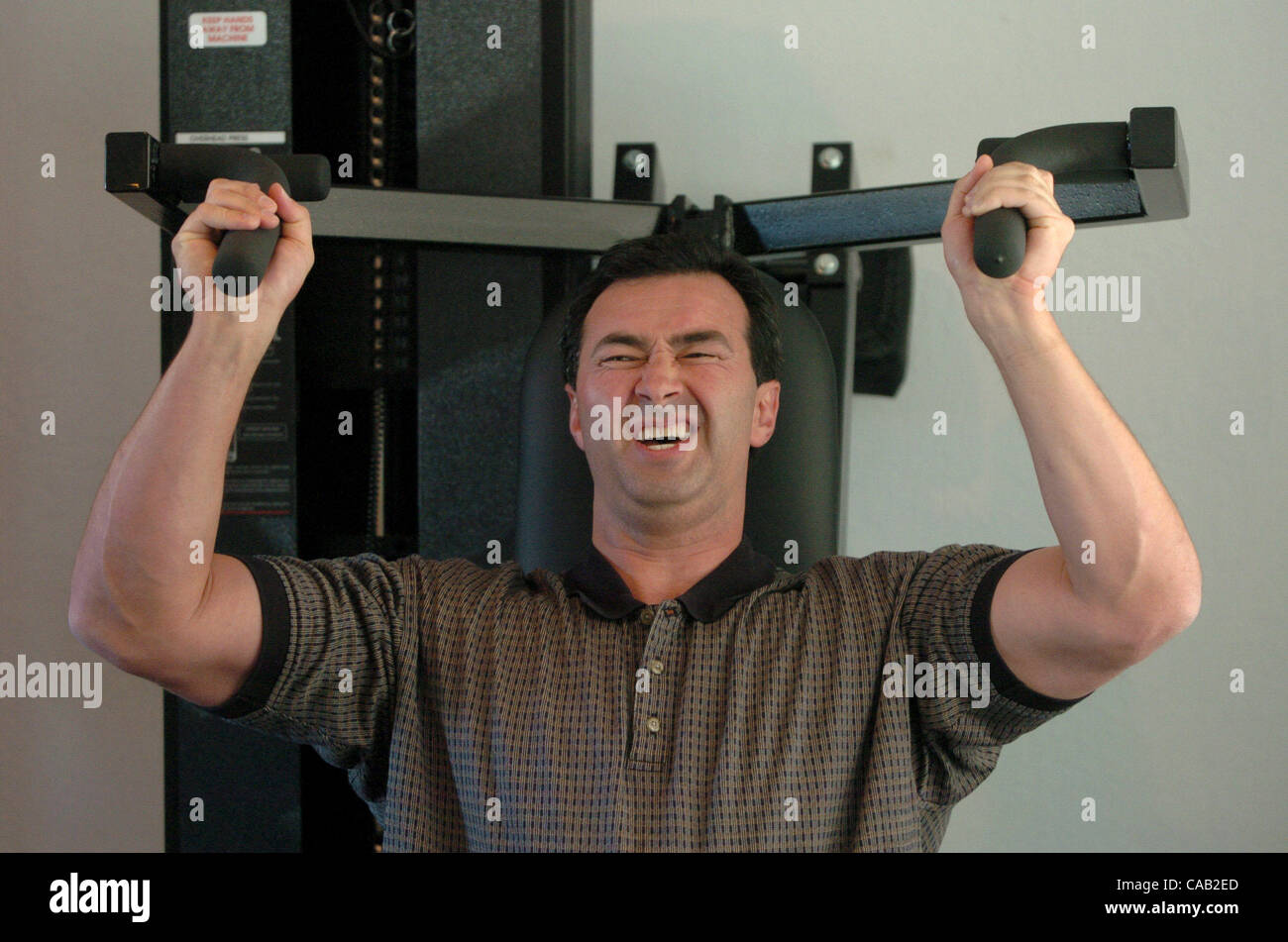 Robin Leamy, 42, of Lafayette strains during his last repitition March