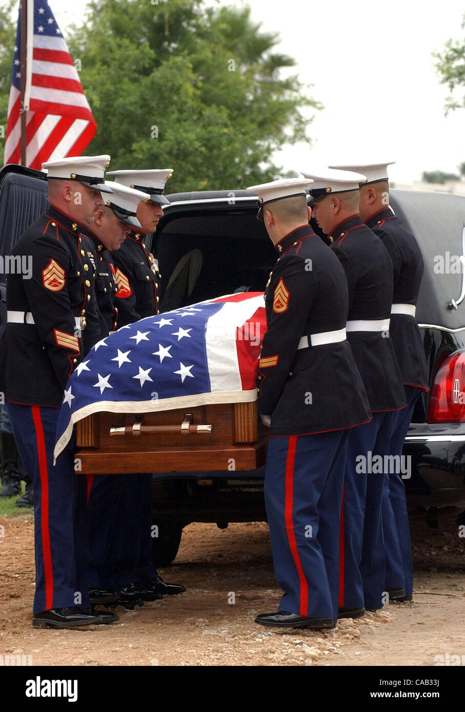 DUSTIN SEKULA FUNERAL:Draped with the American flag Det.Co. Marines of the 4th division carry the casket of Pfc. Dustin Sekula,18, of Edinburg, Texas Friday April 9,2004. Pc. Sekula was the first Hidalgo County soldier to die in Iraq. (DELCIA LOPEZ/San Antonio Express-News) Stock Photo