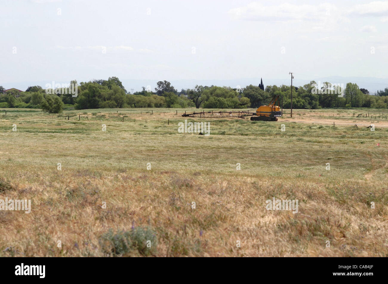 A crane sits on the 310 acre Delta Coves site in Bethel Island, Calif