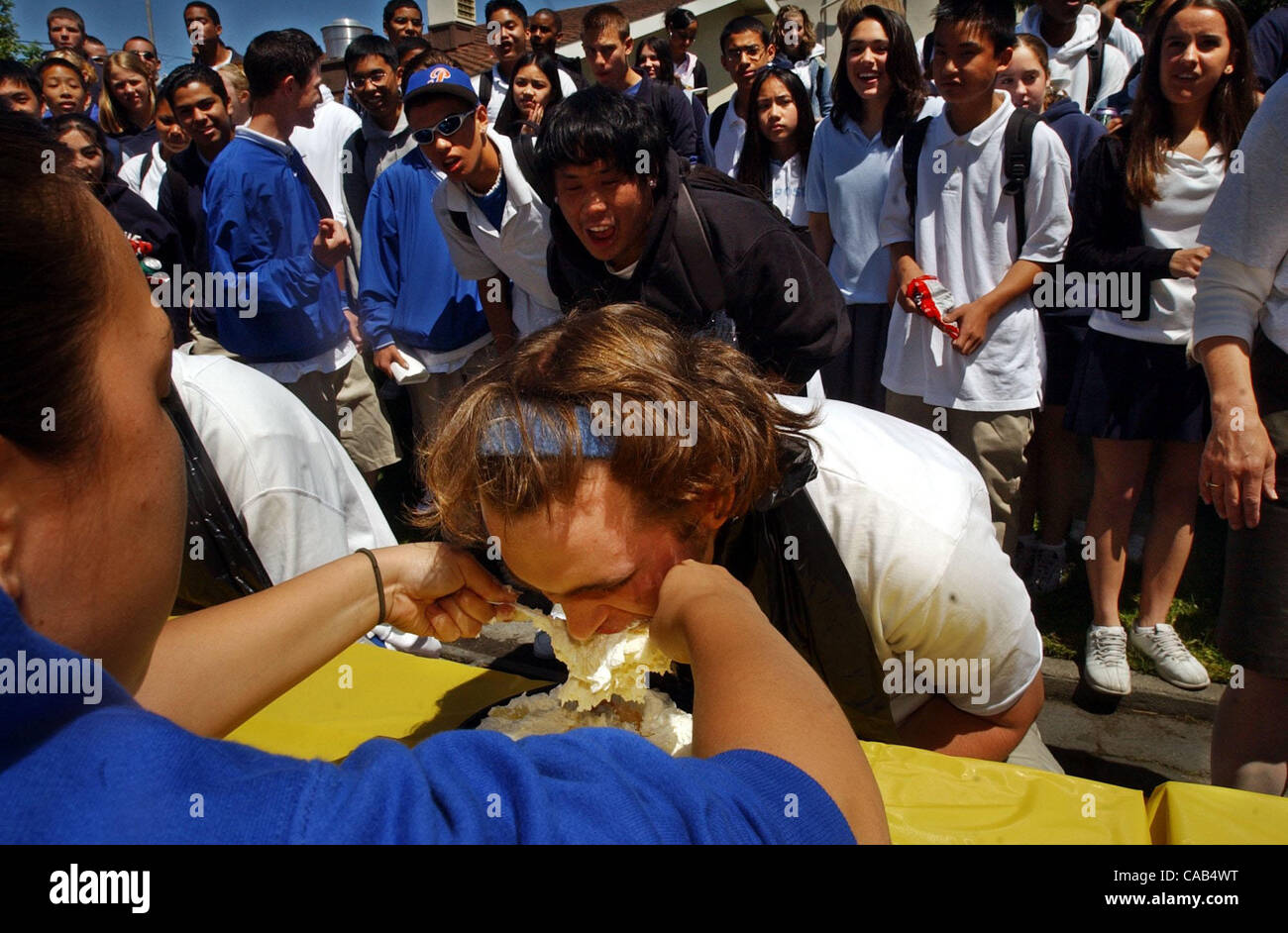 The Pi Festival took place this week at St. Joseph's High School in Alameda, Calif., where the endless number pi was celebrated. On Friday, April 23, 2004, the festival was wrapped up with a pie eating contest, won by Jacob Benz, 17, after eating 496 grams of a lemon cream pie fed to him by Gabriell Stock Photo