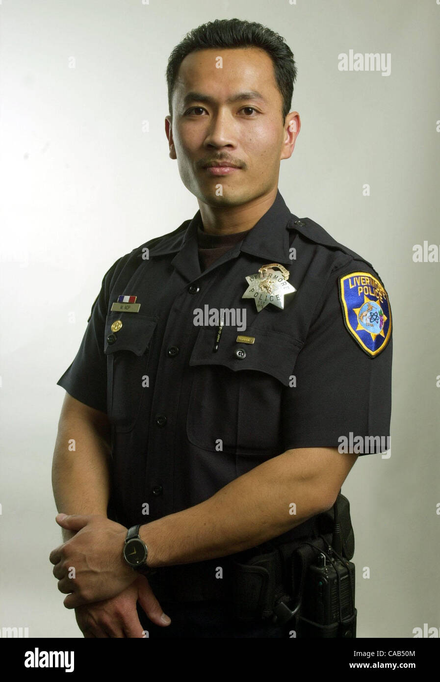 Officer Mony Nop is a DARE instructor and a community liaison.  Photo taken at the Carnegie Building in Livermore, Calif. on Thursday, April 22, 2004.  (CONTRA COSTA TIMES/TUE NAM TON) Stock Photo