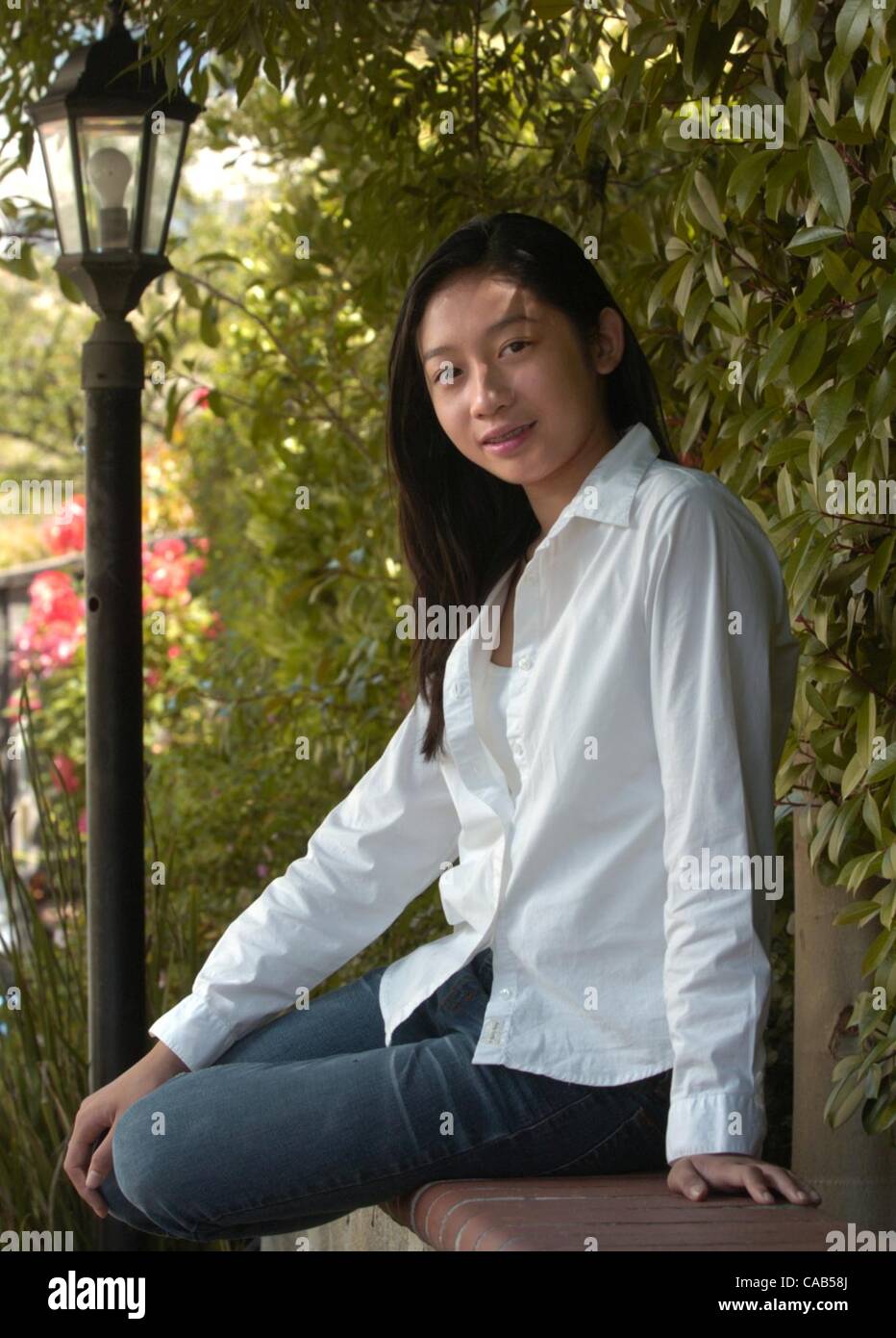 Neyshia Go, 13, poses for a photo at her home in Antioch, Calif. Sunday