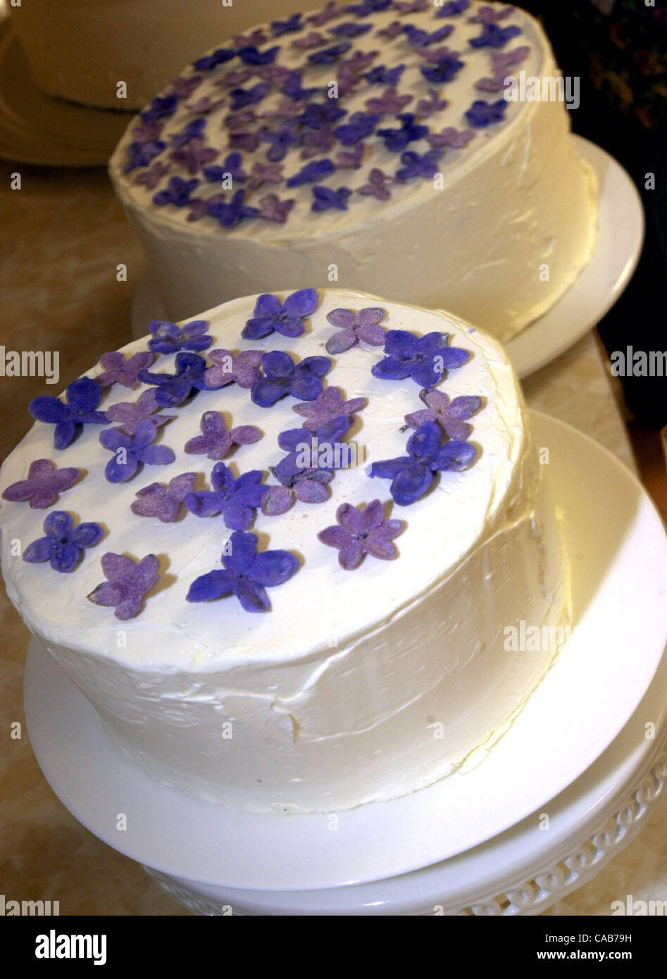 Eileen Kilmartin put sugar coated edible lilac flowers on one of her