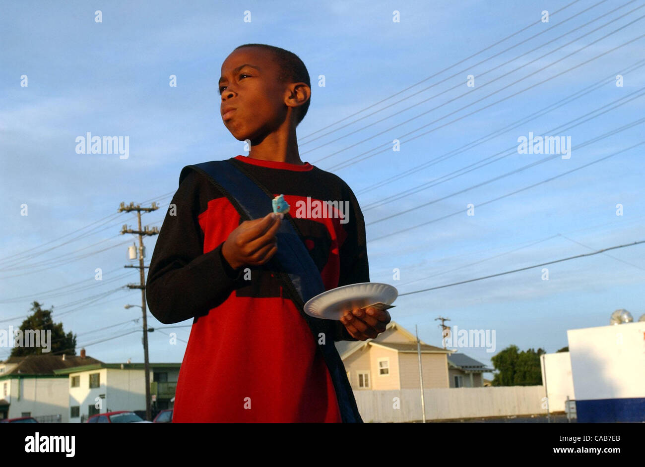 Eleven year old Krystian Brooks, 11, finishes breakfast, a wild berry