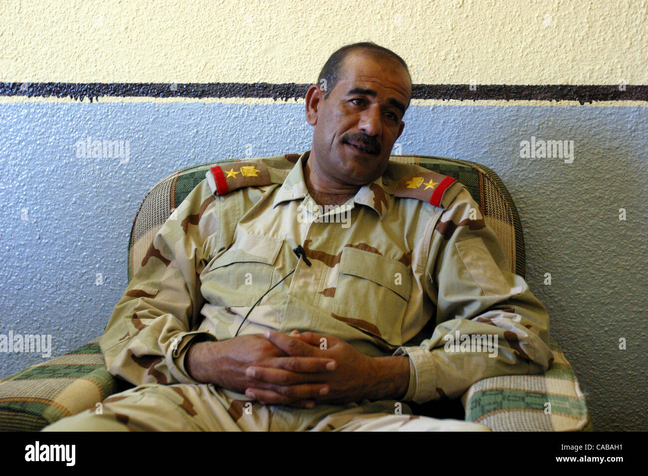 May 18, 2004 - Qayarrah, Iraq - LTC ALI HUSSEIN AL-JABOURI, commander of  the 102nd Iraqi Civil Defense Corp (ICDC) battalion sits for an interview  at the U.S. military base near Qayyara.
