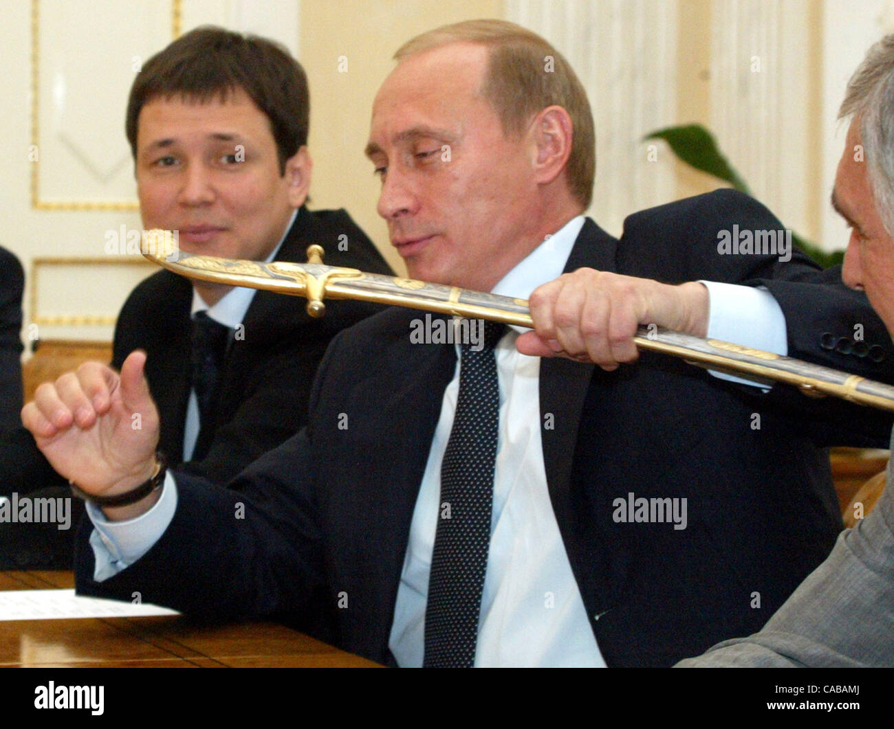 The president of the Russian Federation at a meeting in the Kremlin has congratulated groznensky football club ` Terek ` on a victory over the Cup of Russia. The president of Russia Vladimir Putin and Chairman of the government - acting the President of the Chechen Republic Sergey Abramov. A sabre - Stock Photo