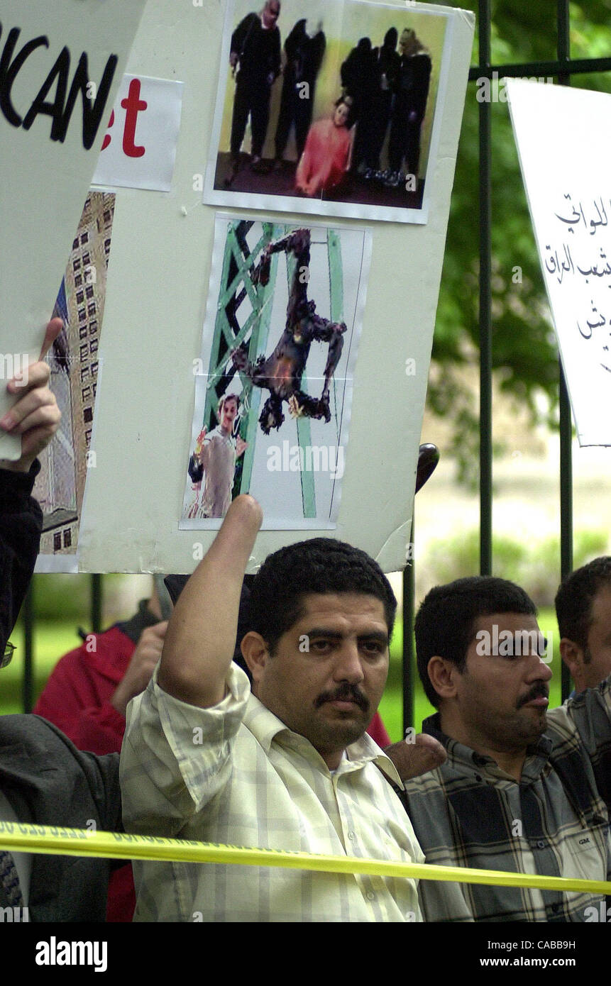 Jun 05, 2004; Washington, DC, USA; Protesters marched in the streets of  Washington DC, from the White House to the house of Donald Rumsfeld. Here a pro-war demonstrator, a victim of Saddam Hussein's brutal regime denounces the protesters. Stock Photo
