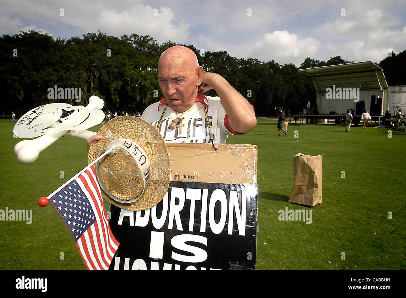 Andy Prolife Anderson 77,  (that is his legal name) waits for other demonstrators at Forsyth Park in Savannah where a massive anti-war protest was planned  Tuesday. Less than 200 protesters showed up. ©Robin Nelson /ZUMA Stock Photo