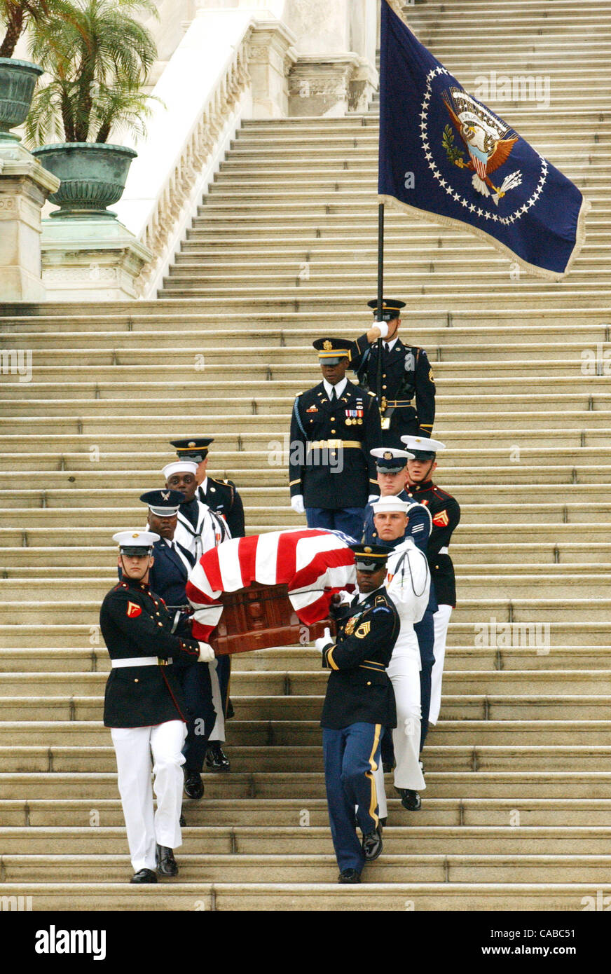The casket of former President Ronald Reagan is escorted down the steps ...