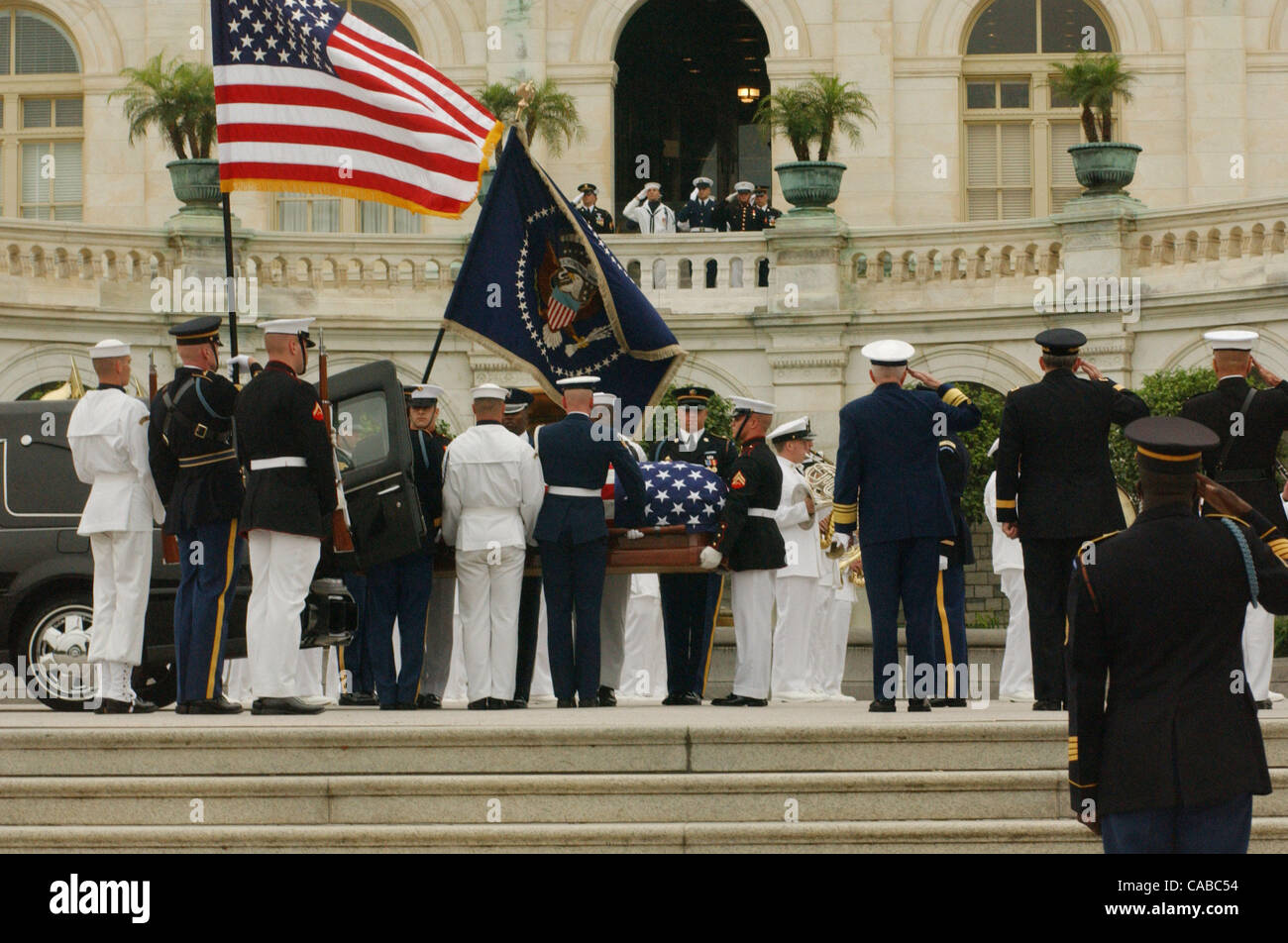 The casket of former President Ronald Reagan is escorted down the steps ...