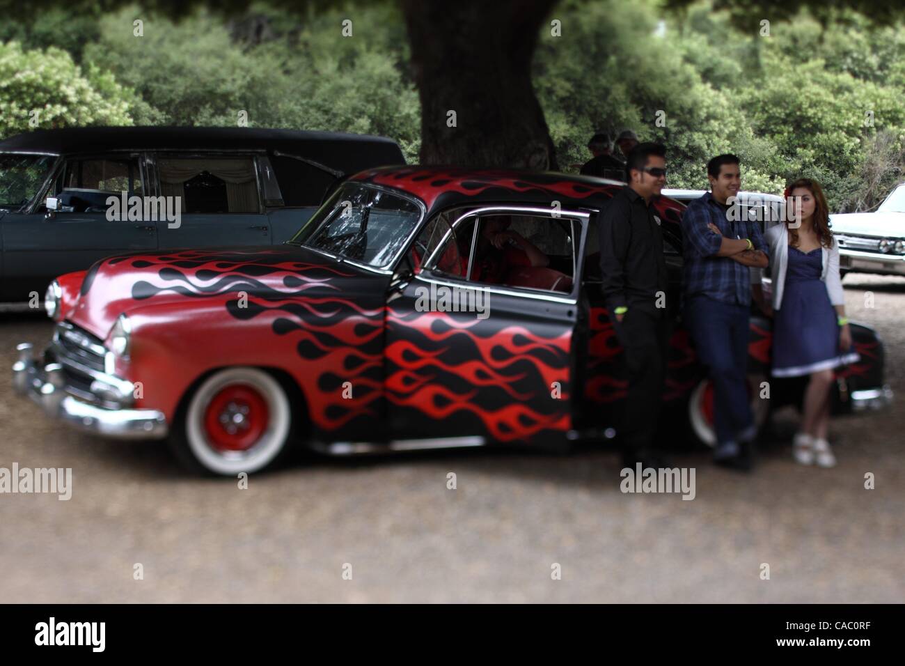 Jul 03, 2010 - Irvine, California, USA - The 16th annual Hootenanny music and cultural festival at Oak Canyon Ranch. People arrive at the rockabilly music festival in a 1951 Chevy painted black with red flames. (Credit Image: Â© Chris Lee/ZUMApress.com) Stock Photo