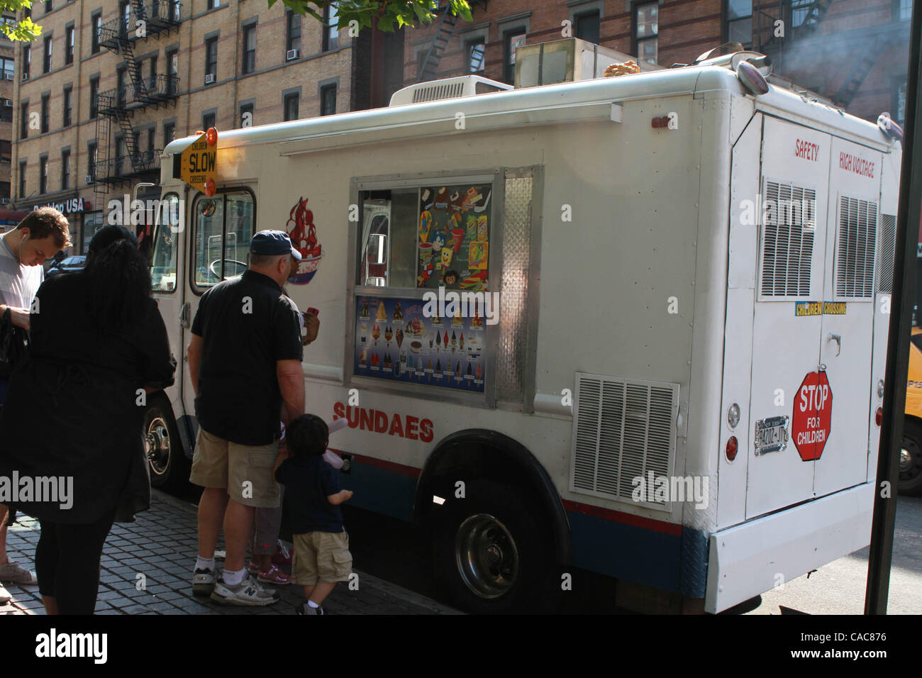 Ice cream truck idling on Lexington Ave. and East 96th. St. in front of playground and school