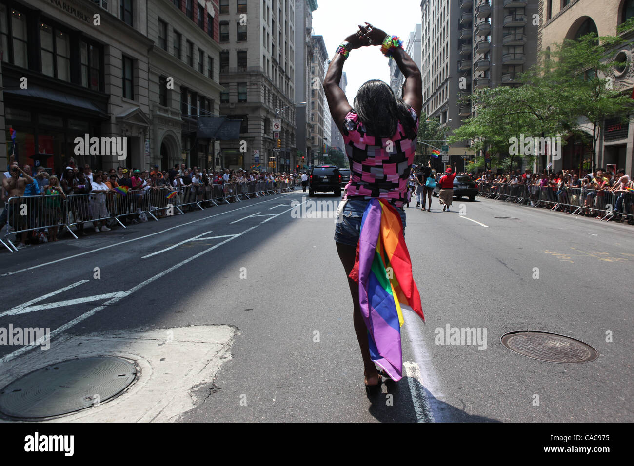 New Yorkers celebrating the Gay Pride Parade along Fifth Ave. in ...