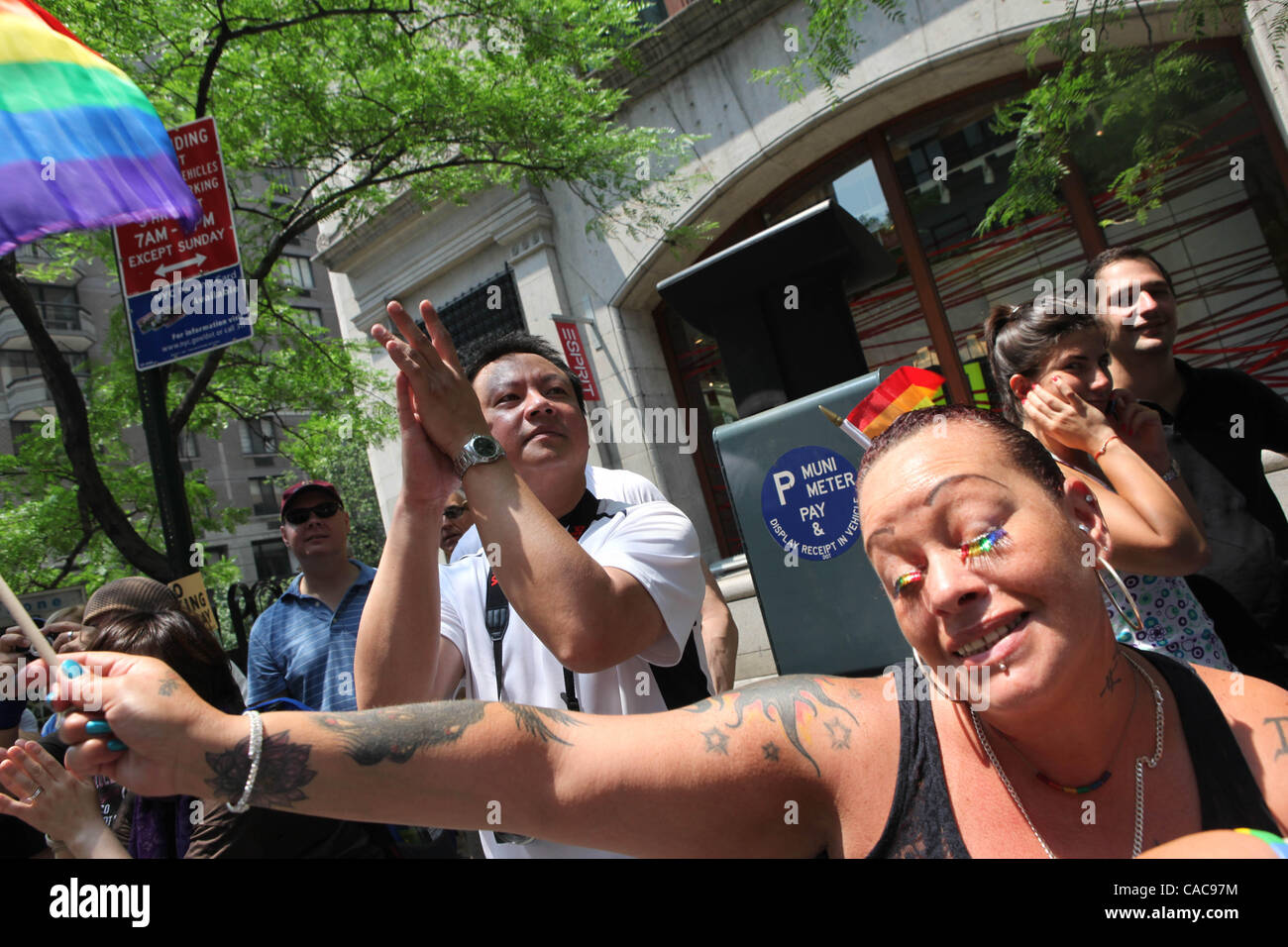 New Yorkers celebrating the Gay Pride Parade along Fifth Ave. in ...