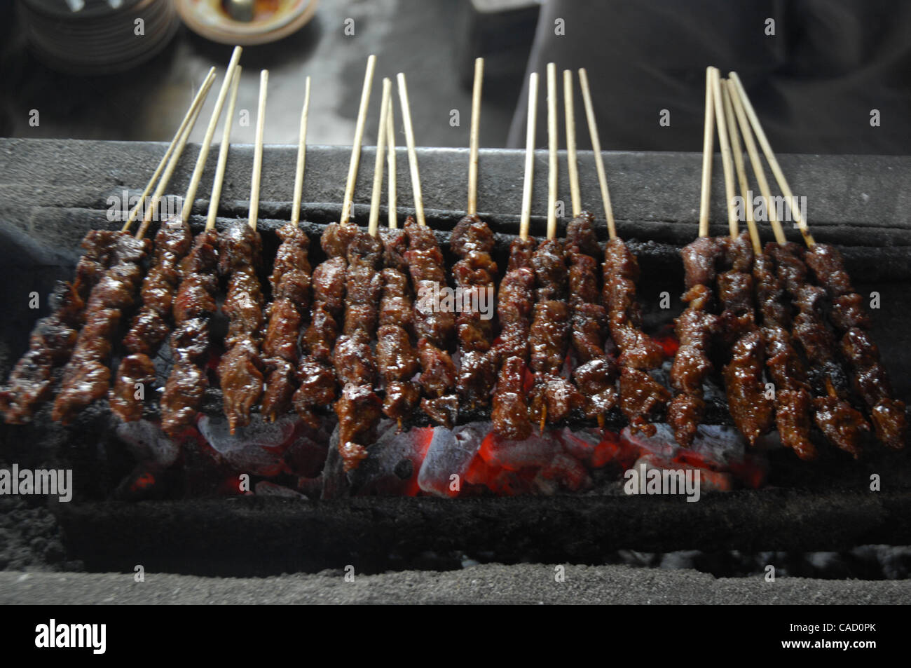 A food seller grill horse meat satay in Yogyakarta, Java Island