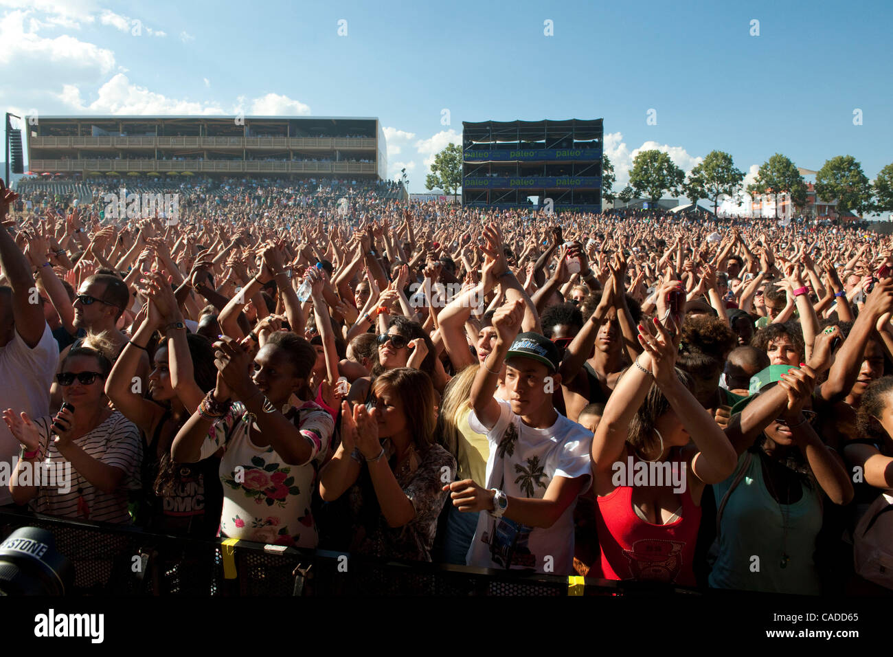 July 20, 2010 - Nyon, Nyon, Switzerland - Thousands of  fans cheer during the performance  of the N.E.R.D. on the PALEO festival in NYON. .PalÅ½o Festival is today one of EuropeÃ•s most important musical events. Since its creation, the Festival has been growing in a regular and managed way, gaining  Stock Photo