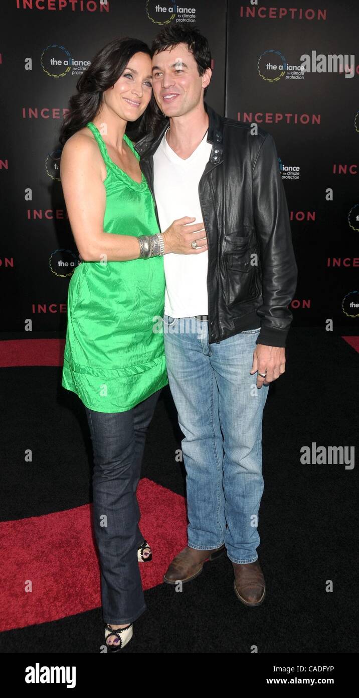 Jul 13, 2010 - Los Angeles, California, USA - Actress CARRIE ANNE MOSS and husband STEVEN ROY at the 'Inception' Los Angeles Premiere held at Grauman's Chinese Theater, Hollywood. (Credit Image: Â© Paul Fenton/ZUMA Press) Stock Photo