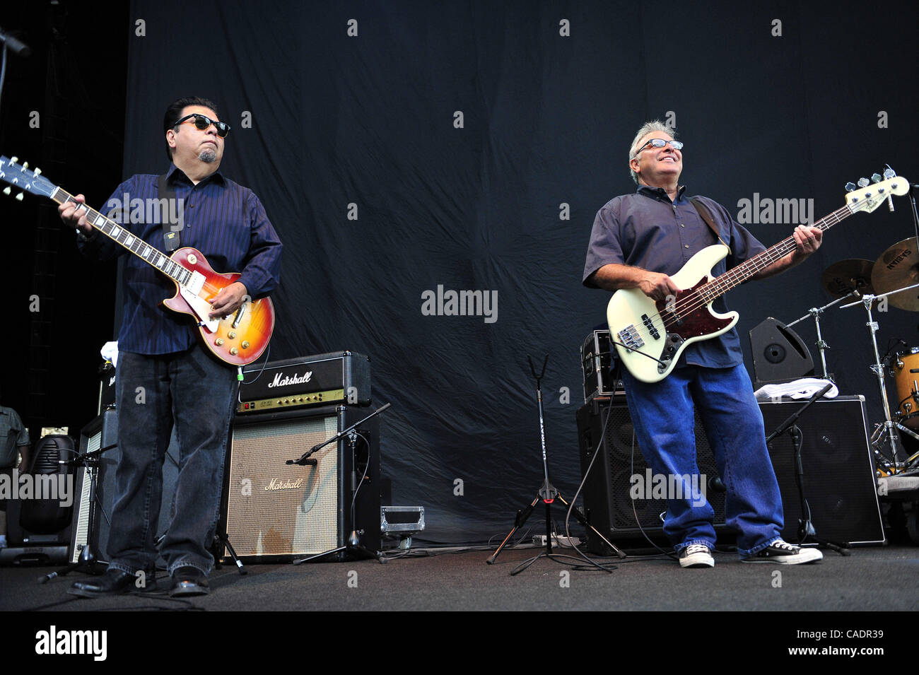 Cesar Rosas (left) and Conrad Lozano of the band Los Lobos performs a