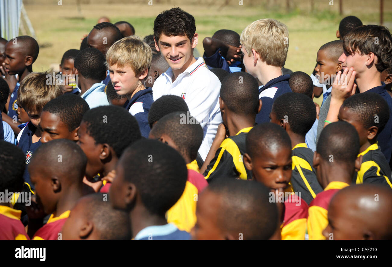 Jun. 08, 2010 - Johannesburg, GAUTENG, SOUTH AFRICA - Students from St. Stithians College Prep wait to hand out complete kits of soccer gear to two township teams. Tuesday, June 8, 2010 during a Dreamfields Project event in the Ivory Park township of Johannesburg, South Africa. The Dreamfields Proje Stock Photo