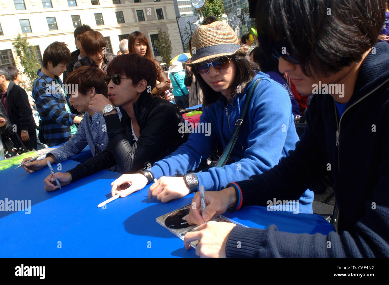 Sep 05, 2010 - Vancouver, British Columbia, Canada - Members of Taiwanese band '1976' signing autographs after their performance at Telus TaiwanFest 2010 in Vancouver. Last spring, '1976' was invited as the opening guest for the Oasis Live Forever Tour in Taipei, the first Taiwanese band ever to per Stock Photo