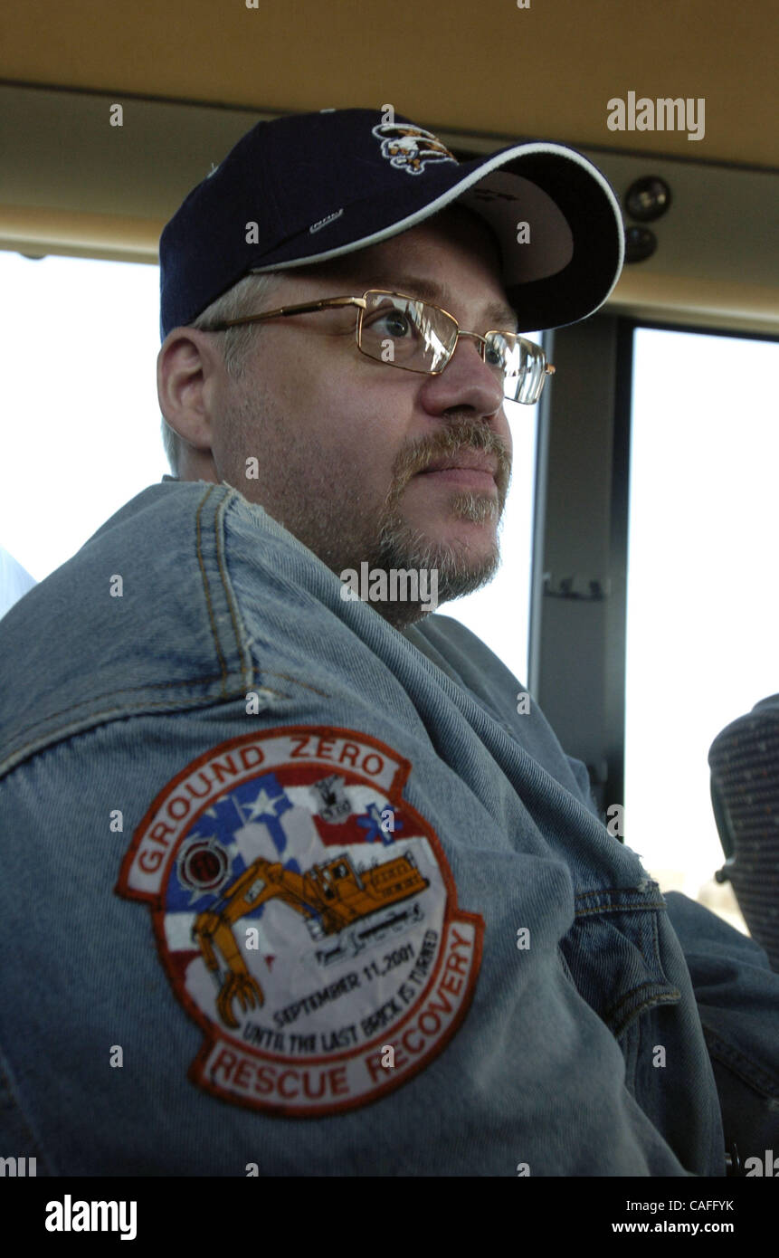 Keith LeBow, 44, of Inwood, who volunteered as an ironworker at Ground Zero, discusses his condition aboard a bus to Washington D.C. as John Feal, founder and president of the Feal Good Foundation sponsors 'Journey For Justice' bus trip to Washington D.C. to protest cuts to 9/11 first responder medi Stock Photo