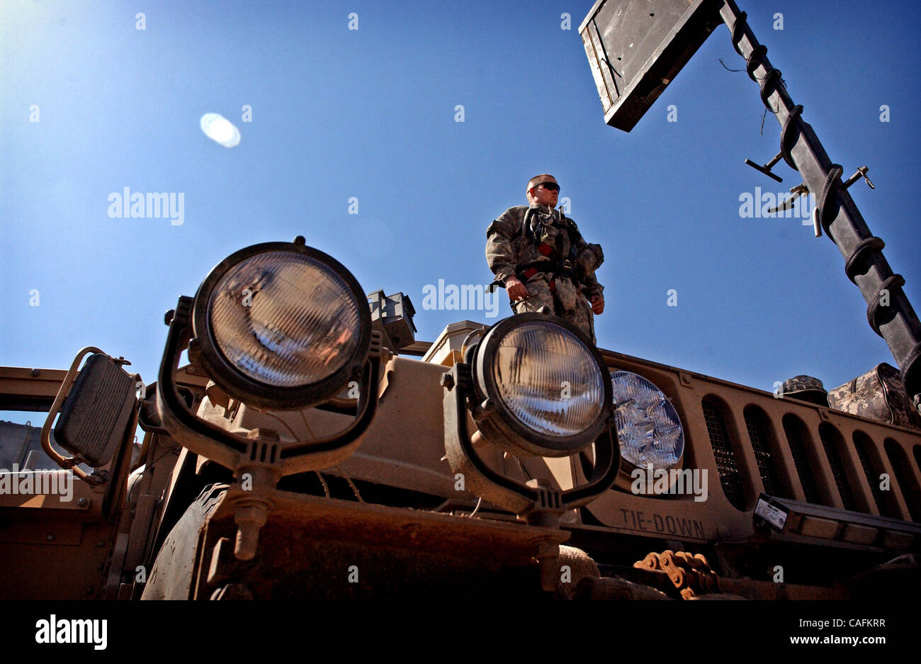 Feb 28, 2008 - Scania, Iraq -  Pfc. DARYL SKELLEY, of the 3rd Battalion, 319th Airborne Field Artillery Regiment, stands atop his Humvee at Scania as he waits for the convoy to move out on its last leg of their trip to Camp Adder in Southern Iraq.  The 82nd's 1st Brigade Combat Team's mission is to  Stock Photo