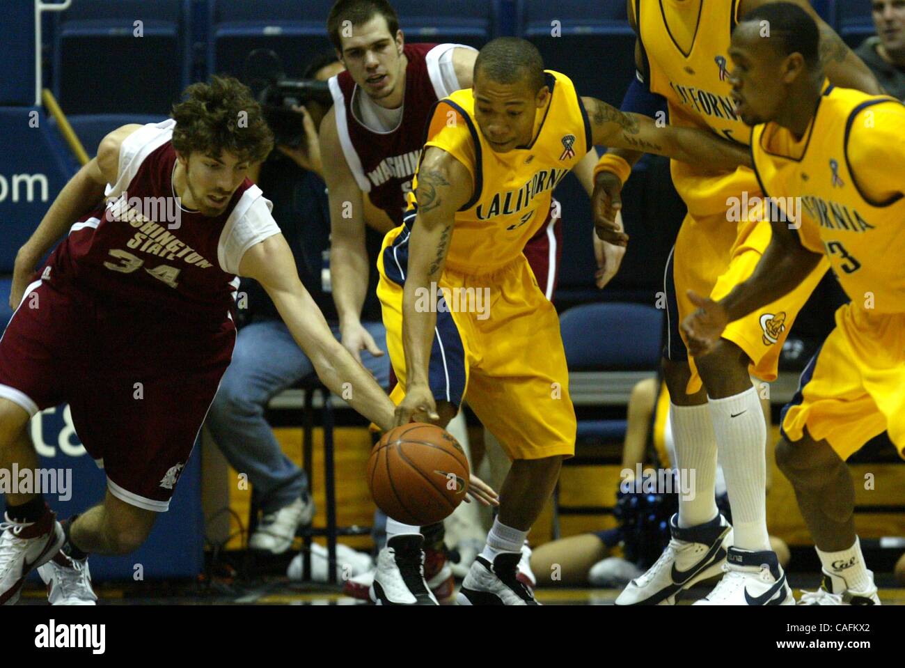 Washington State's Robbie Cowgill, left, and Cal's Jerome Randle struggle for a loose ball during the first half at Haas Pavilion in Berkeley, Calif., on Thursday Feb. 28, 2008.  (Ray Chavez/The Oakland Tribune) Stock Photo
