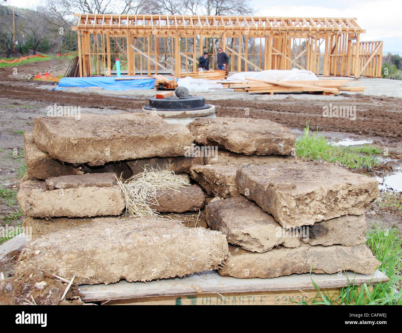 Adobe blocks melt down as a reproduction of an old bunk house goes up at the Alviso Adobe Community Park in Pleasanton, Calif. Wednesday, February 20, 2008. (Jay Solmonson/Tri-Valley Herald) Stock Photo