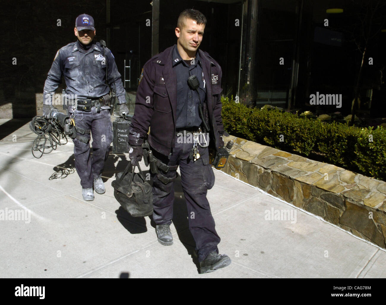NYPD ESU officers exit the office building of Kathryn Faughy. Kathryn Faughy, an Upper East Side psychologist was violently murdered in her office on East 79th Street two nights ago by a man who brought along two bags filled with knives, rope, duct tape, women's clothing and adult diapers. Stock Photo