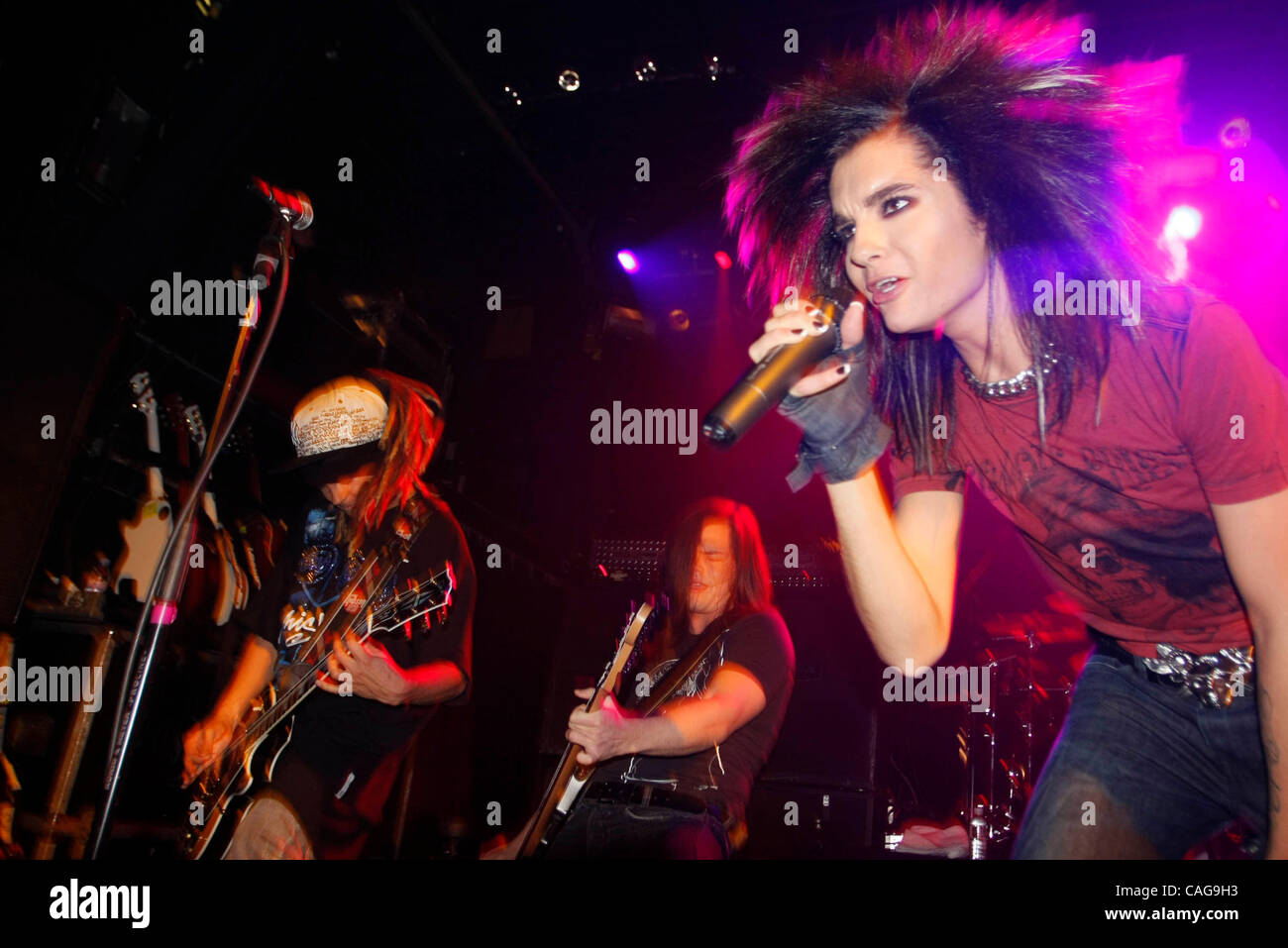 Tokio Hotel performing at The Fillmore at Irving Plaza on February 18, 2008.  Bill Kaulitz- lead vocals - (black hair) Tom Kaulitz - lead guitar (dreads) Georg Listing- bass (long straight brown hair) Gustav Schafer- drumsTokio Hotel performing at The Fillmore at Irving Plaza on February 18, 2008.   Stock Photo