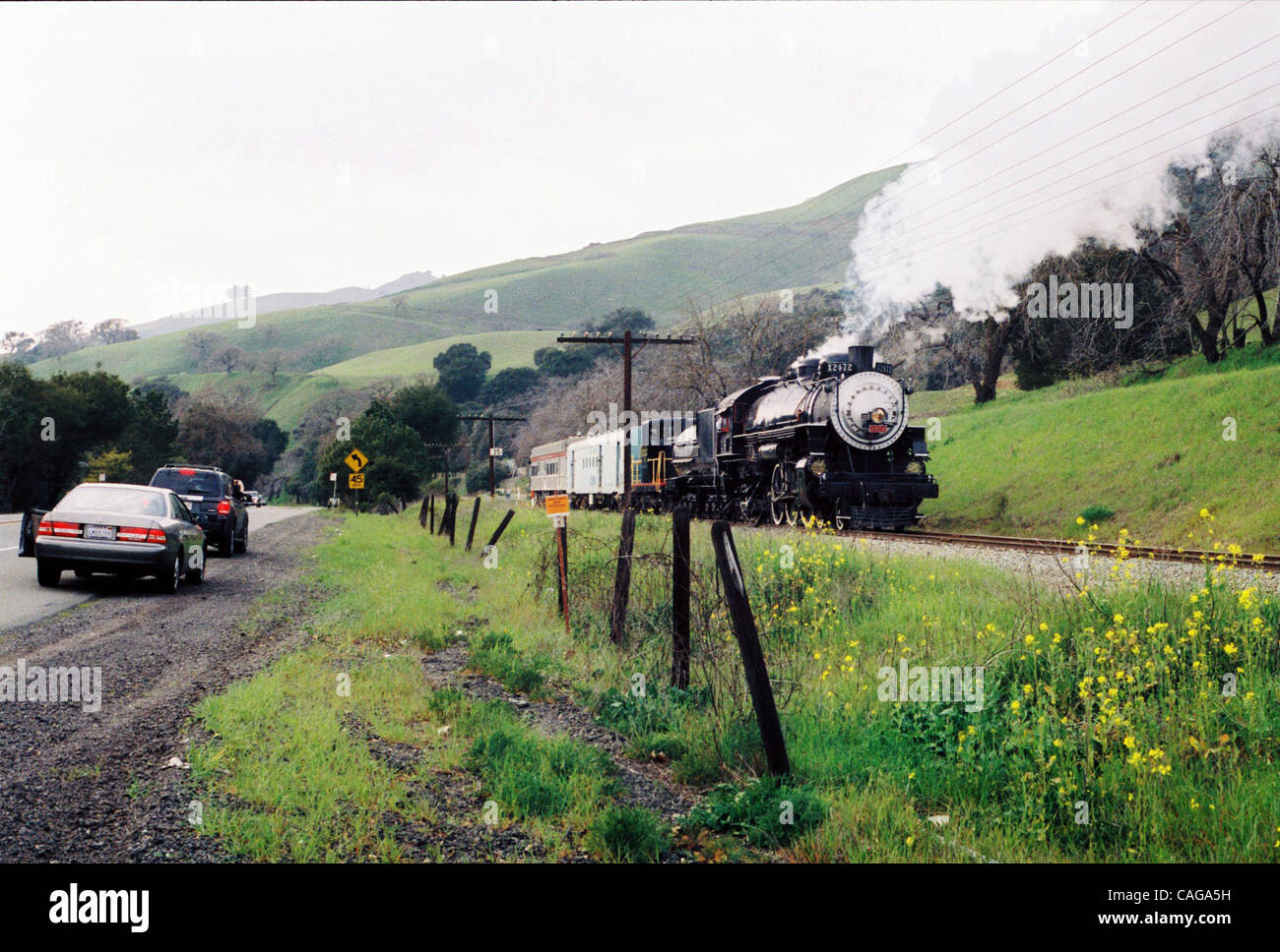 EX-SOUTHERN PACIFIC 2472, last used in revenue service pulling commuter trains on the Peninsula, backs down Niles Canyon west of Sunol on Monday afternoon ...
