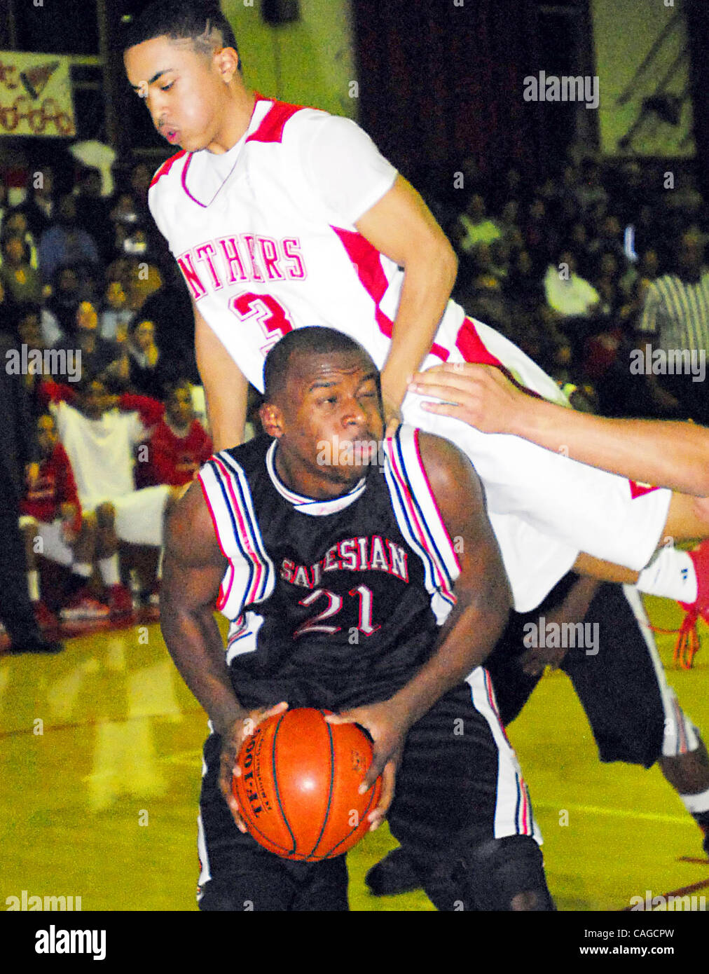 St. Mary's Neil Sampson (top) lands on Salesian's Kendell Andrews
