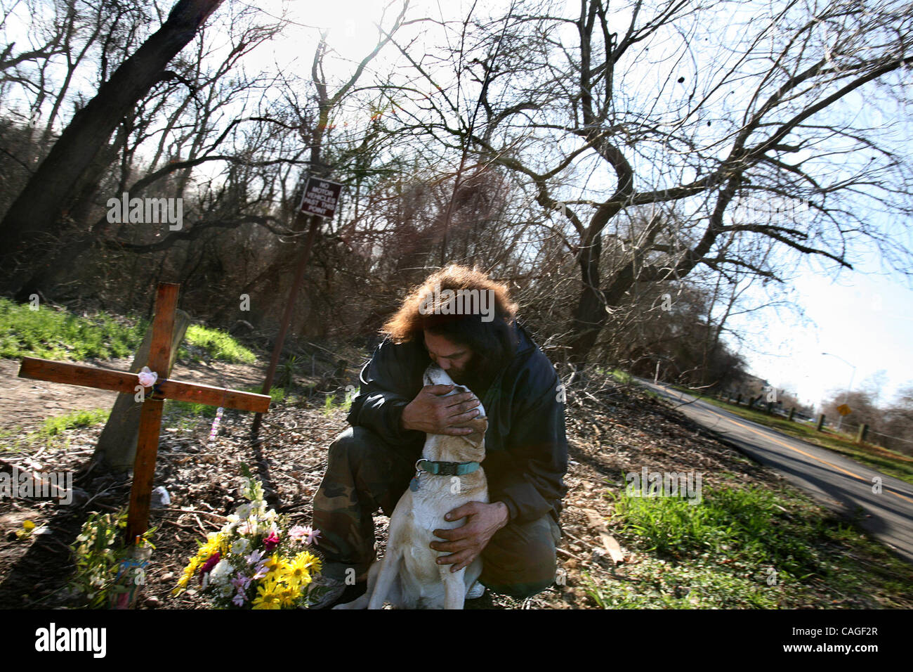 JUMP Thomas Roper holds his dog Ginger next to him at his mothers ...