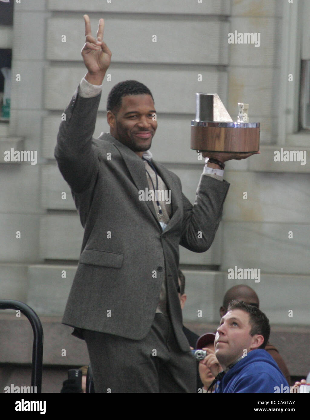 Feb 05, 2008 - New York, NY, USA - New York Giants player MICHAEL STRAHAN holds the George C. Halas trophy of the NFC Championship during New York Giants Super Bowl XLII victory ceremony held at City Hall in Lower Manhattan. (Credit Image: © Nancy Kaszerman/ZUMA Press) Stock Photo