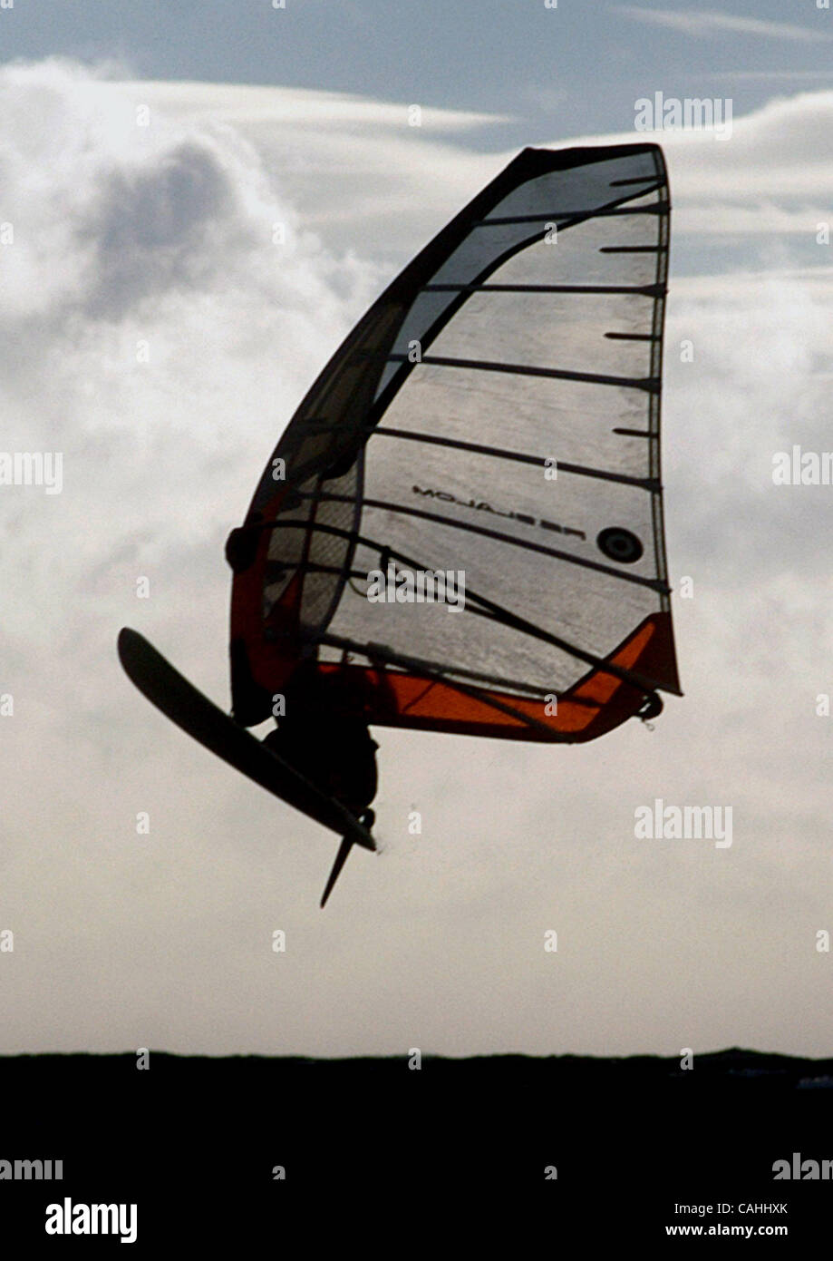 Dec 04, 2007 - Kihei, Hawaii, USA - A wind surfer rides the Kona winds on Tuesday afternoon. Kona winds gusted nearly 50 mph amid torrential rains in Maui, Hawaii the following day. The early winter storm moved down the island chain hitting Maui and the Big Island the hardest. According to the Count Stock Photo