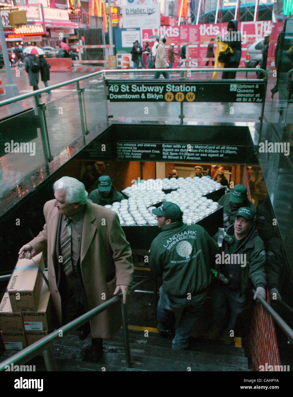 Dec 13, 2007 - Bronx, NY, USA - In Times Square workers carry the 500-pound, brand new seven foot tall numeral '8' that will complete the '2-0-0-8' sign as the Times Square New Year's Eve Ball descends high atop One Times Square on December 31st travels by subway for the first time ever from the fac Stock Photo