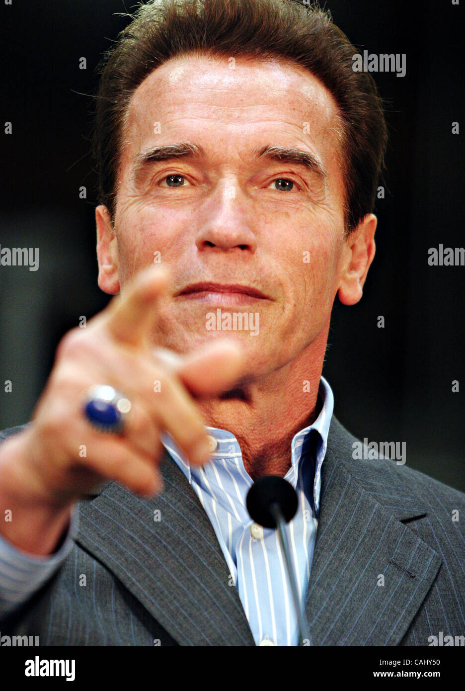 California Governor Arnold Schwarzenegger points to a reporter during a
