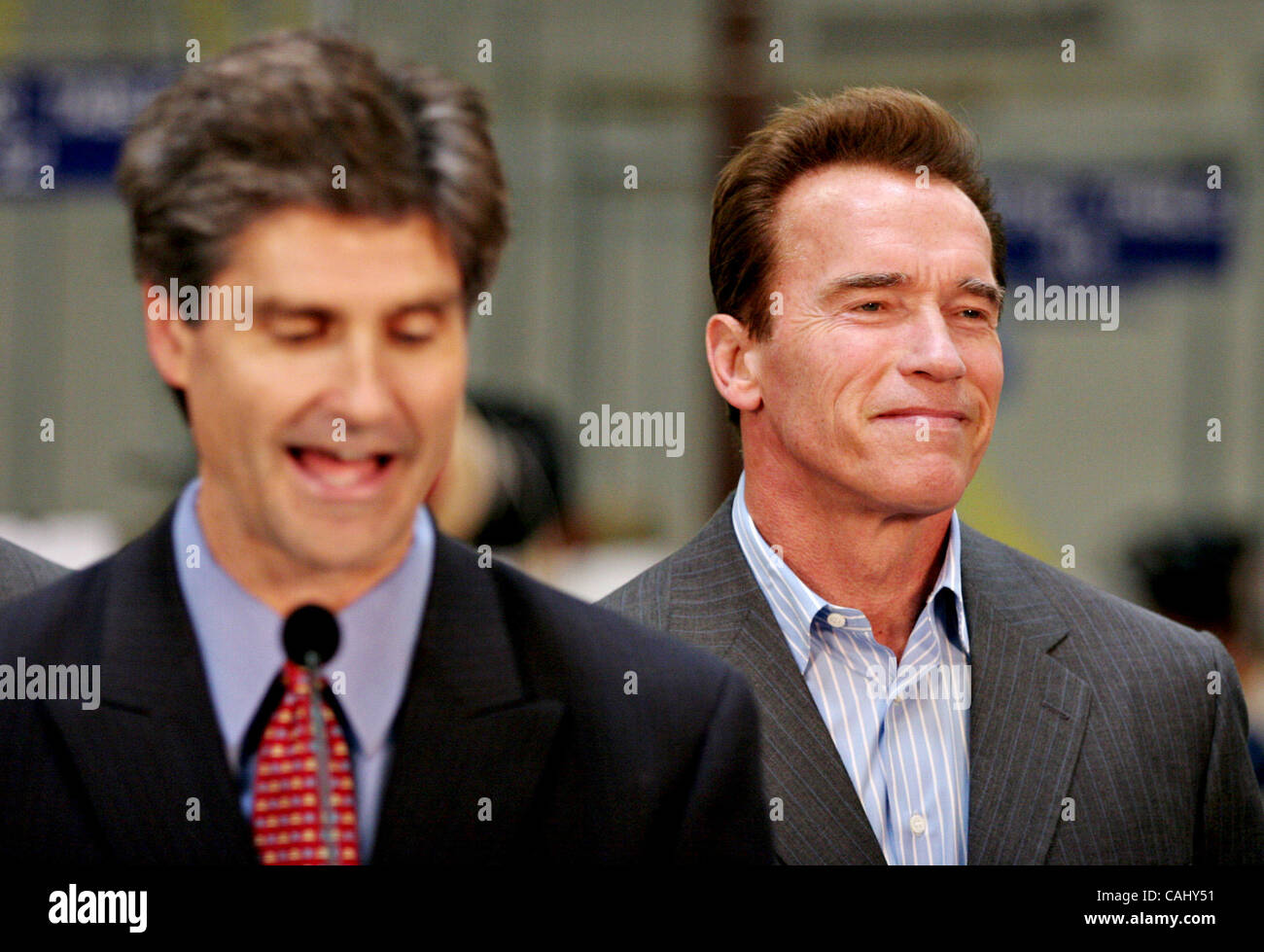 California Governor Arnold Schwarzenegger listens to CEO of the Silicon