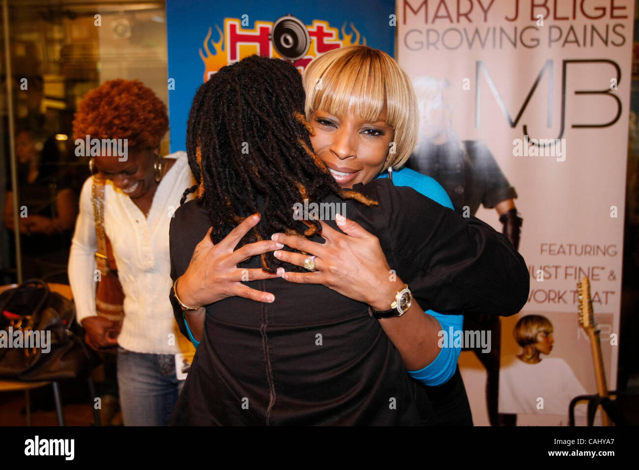 Mary J. Blige performing at Sirius Radio's offices 'fish bowl' for fans. She sang songs from her new album 'Growing Pains' during the live set broadcast on the satellite station NYC December 21, 2007. Stock Photo