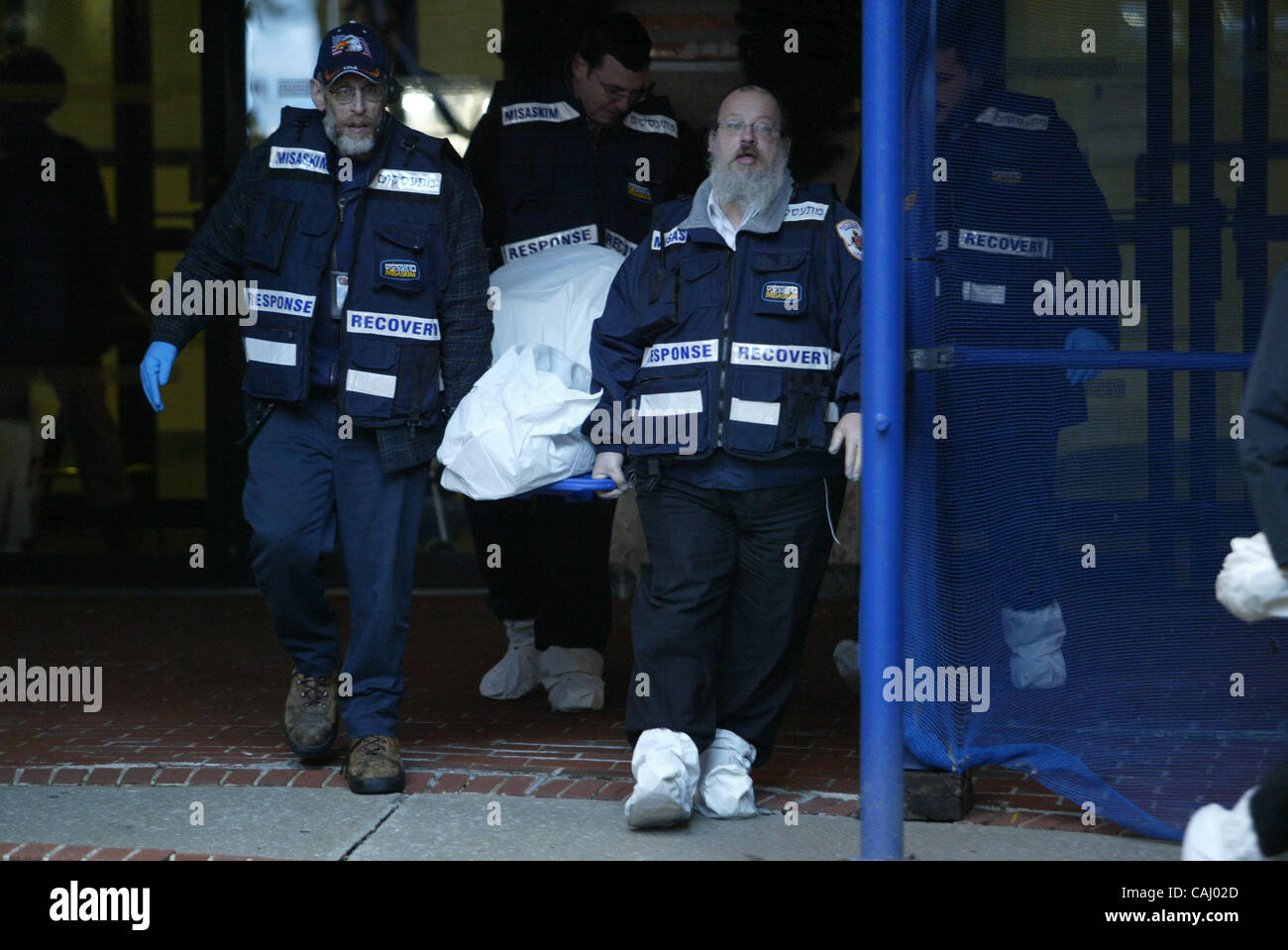EMS taking the body of a smoke inhalation victim of Harvey Kurdish