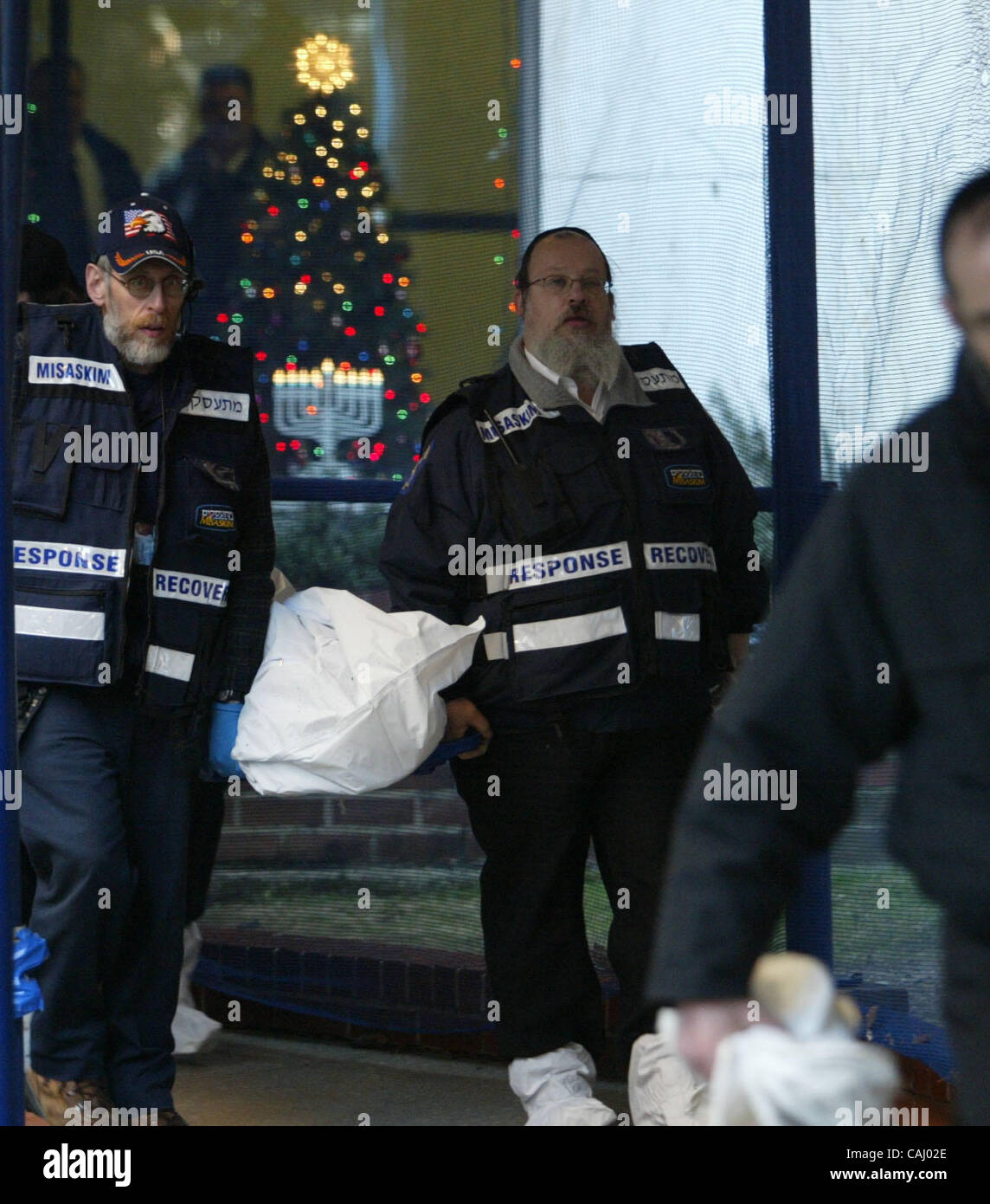 EMS taking the body of a smoke inhalation victim of Harvey Kurdish